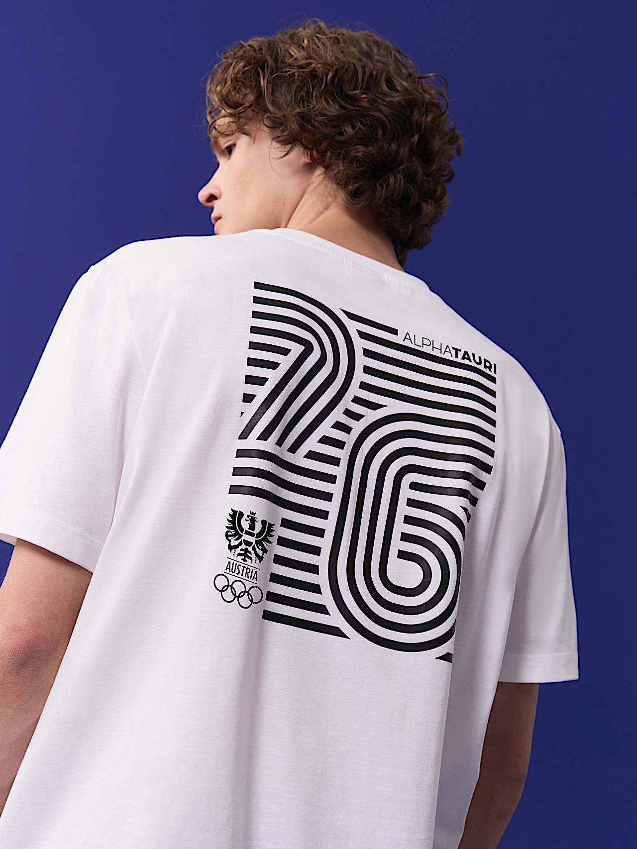 AlphaTauri | Unisex Backprint T-Shirt | Olympic Team Austria Collection in White for Unisex AlphaTauri | Unisex Backprint T-Shirt | Olympic Team Austria Collection in White for Unisex