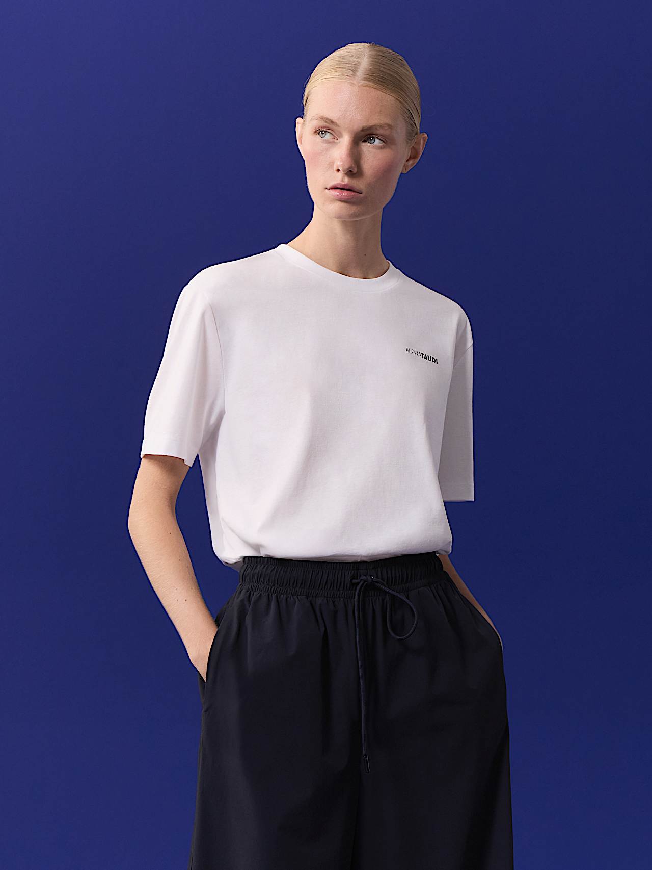 AlphaTauri | Unisex Backprint T-Shirt | Olympic Team Austria Collection in White for Unisex AlphaTauri | Unisex Backprint T-Shirt | Olympic Team Austria Collection in White for Unisex