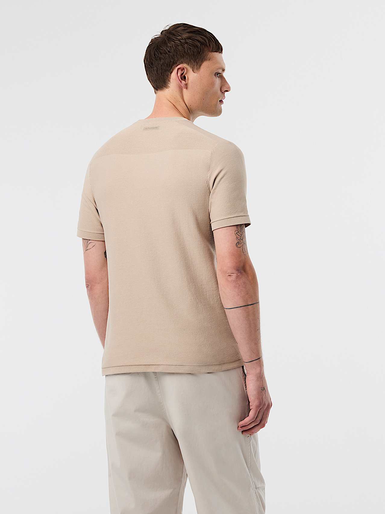 AlphaTauri | FOSOS V5.Y10.01 | Polo de punto técnico en 3D in Dune for Hombre
