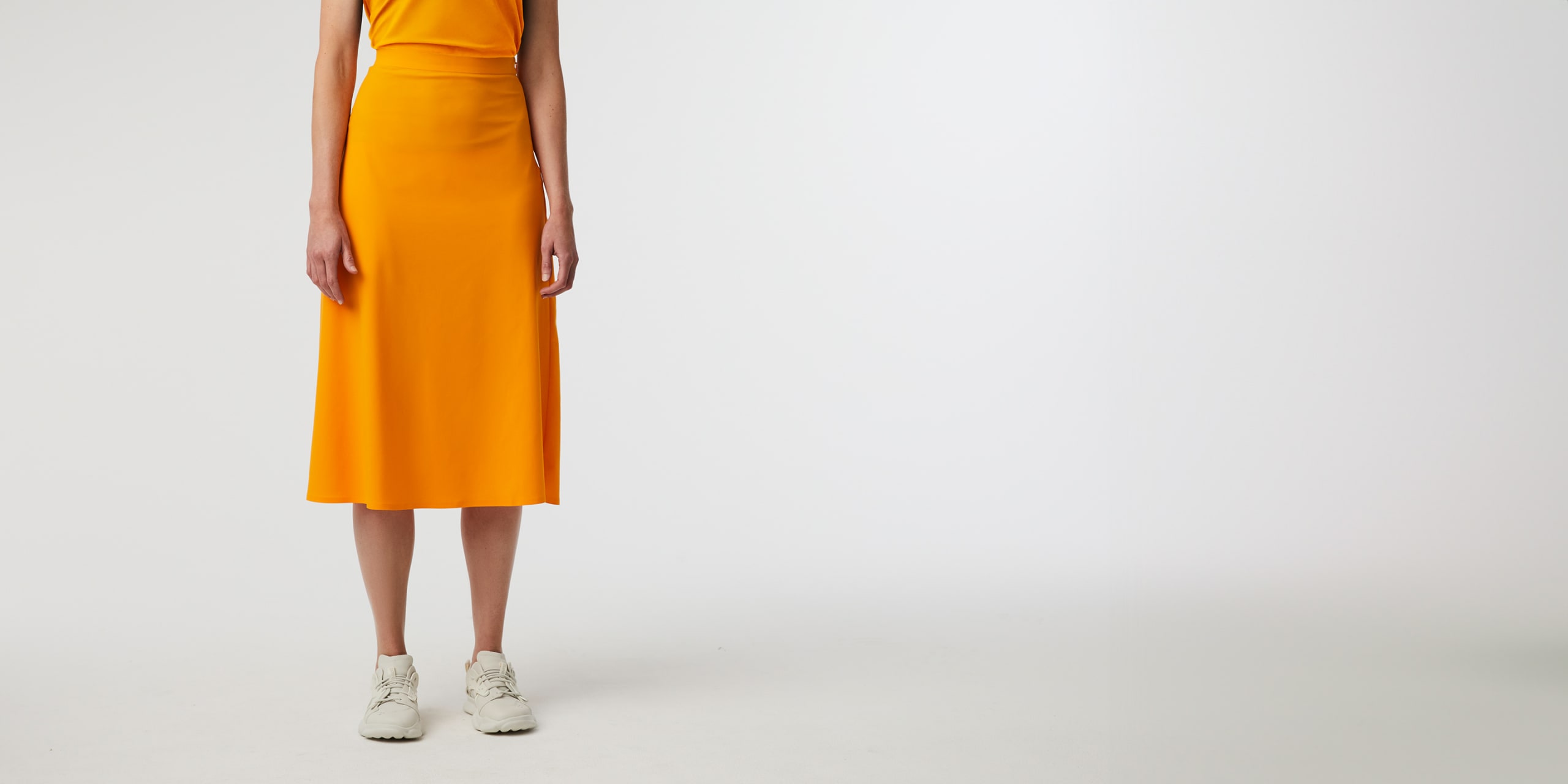 AlphaTauri | PEUS V1.Y7.01 | Power Stretch Jersey Midi Skirt in Warm Yellow for Women AlphaTauri | PEUS V1.Y7.01 | Power Stretch Jersey Midi Skirt in Warm Yellow for Women