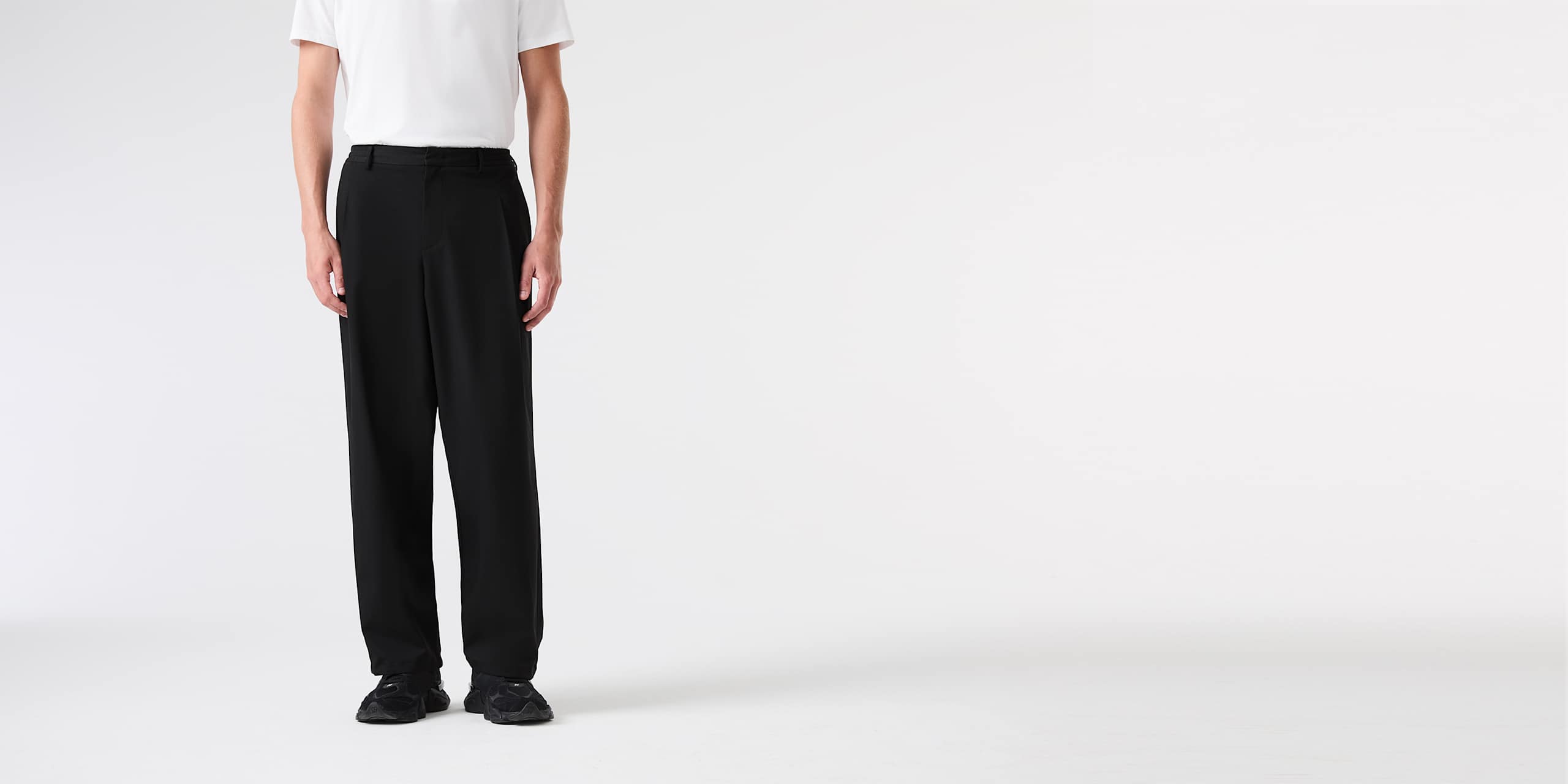 AlphaTauri | PORTER V1.Y9.02 | Baggy Wide Leg Trousers with Pleats and Adjustable Cuffs in Black for Men