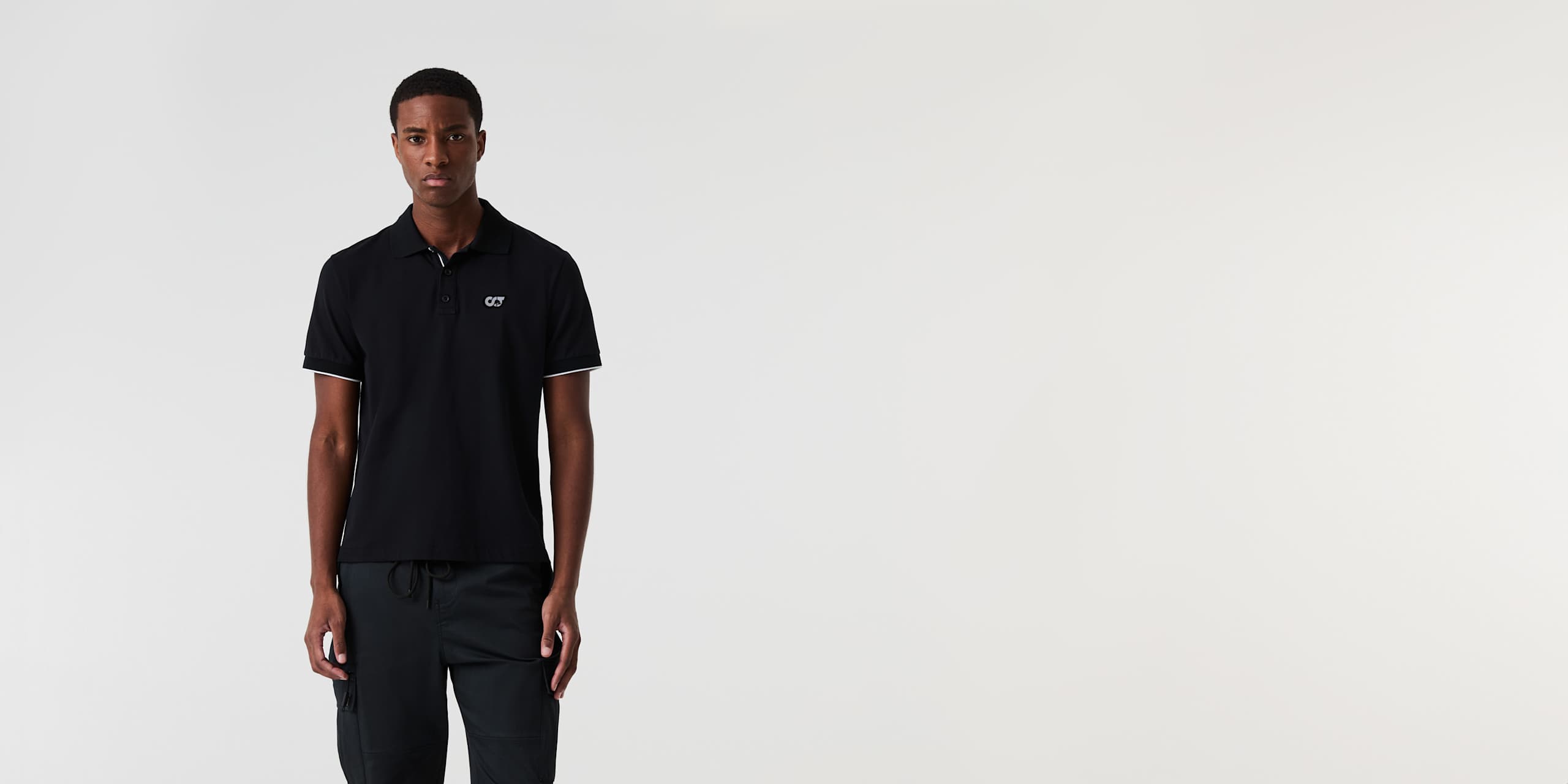 AlphaTauri | JUNX V2.Y9.01 | Piqué-Poloshirt in Schwarz für Herren AlphaTauri | JUNX V2.Y9.01 | Piqué-Poloshirt in Schwarz für Herren